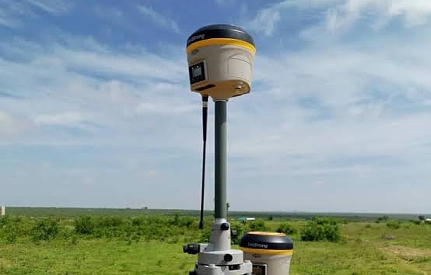 GNSS receivers set up on a tripod in the field