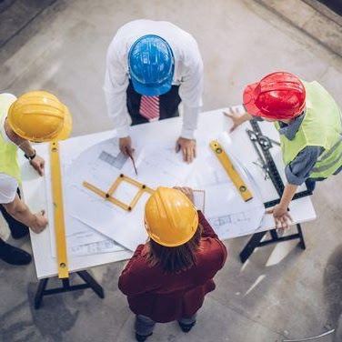 Engineers reviewing drawings